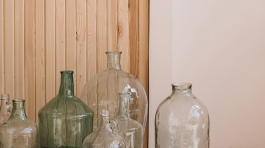 Home interior decoration. Vintage bottles against wooden wall