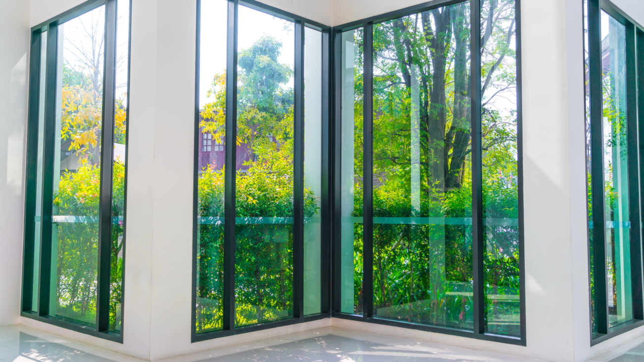 Glass window overlooking green garden